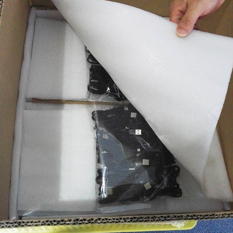 A box with some black and white papers in it