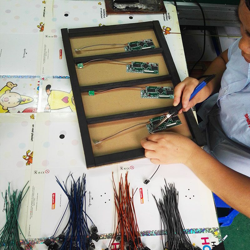 A person working on some sort of device