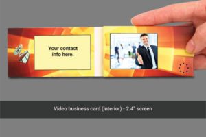 A video business card is shown in front of a hand.