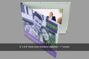 A hard cover brochure with a picture of two people.