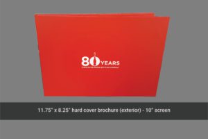 A red folder with the words " 8 0 years ".