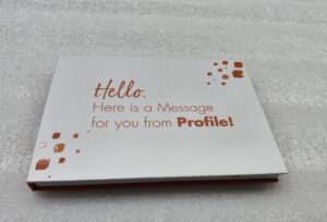 A white card with the words hello here is a message for you from profile