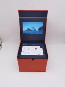 A red box with a screen and a card inside