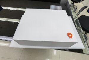 A white box sitting on top of a table.